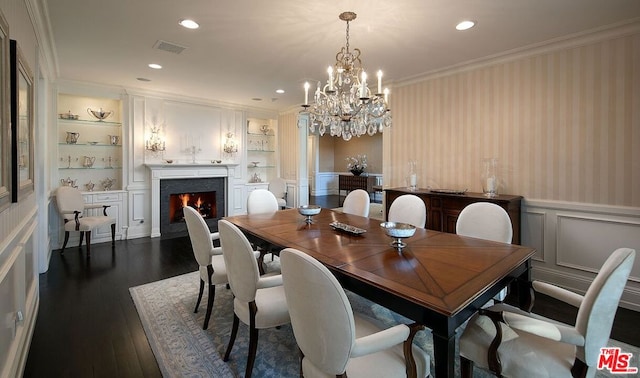 dining area with a notable chandelier, built in shelves, ornamental molding, and dark hardwood / wood-style flooring