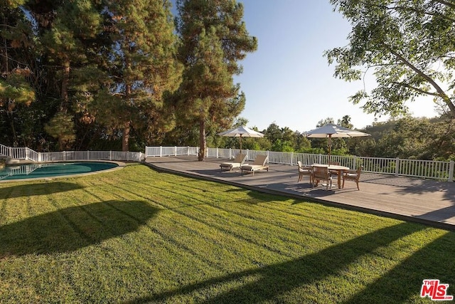 view of yard featuring a pool side deck