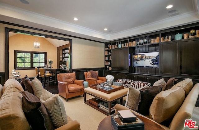 interior space featuring crown molding and a chandelier