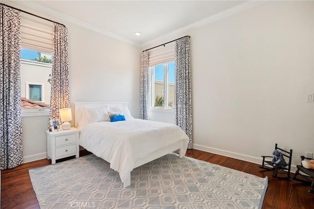 bedroom with hardwood / wood-style floors and crown molding