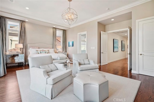 bedroom featuring an inviting chandelier, ornamental molding, and hardwood / wood-style flooring