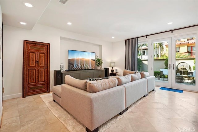 tiled living room featuring french doors