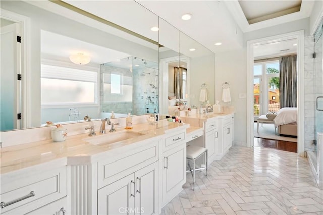 bathroom featuring vanity and a shower with shower door