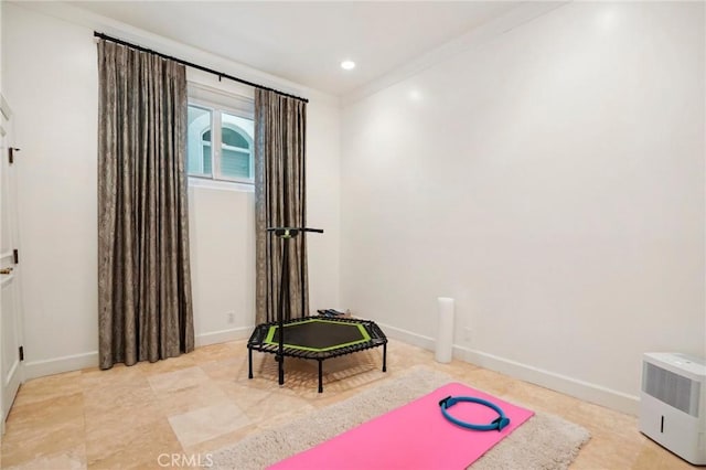 workout area with ornamental molding