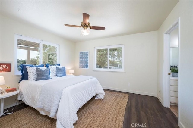 bedroom with ceiling fan and dark hardwood / wood-style flooring