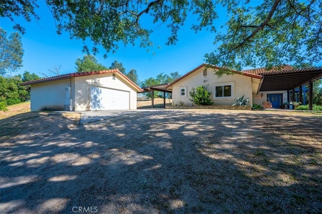 mediterranean / spanish home with a carport