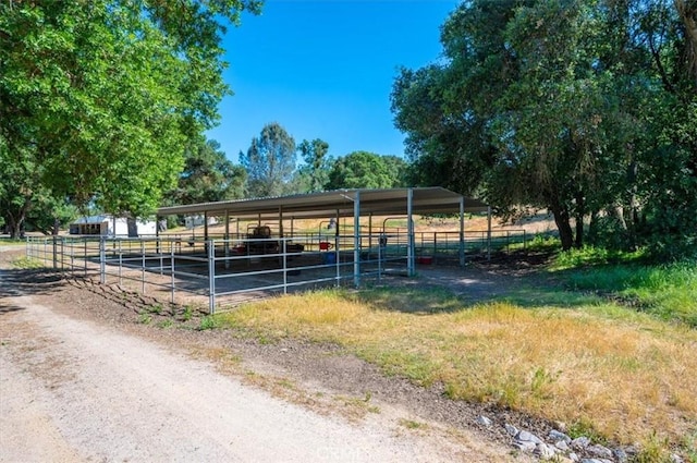 view of stable featuring a rural view