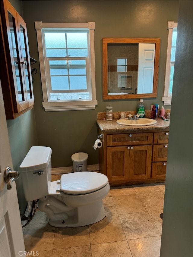 bathroom featuring toilet and vanity