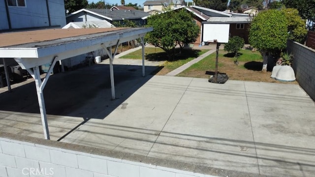 view of swimming pool with a carport