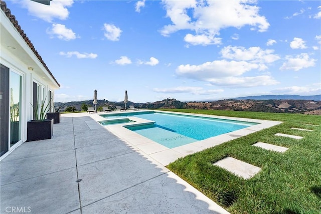 view of swimming pool with a mountain view, an in ground hot tub, and a patio