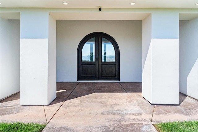 entrance to property featuring french doors