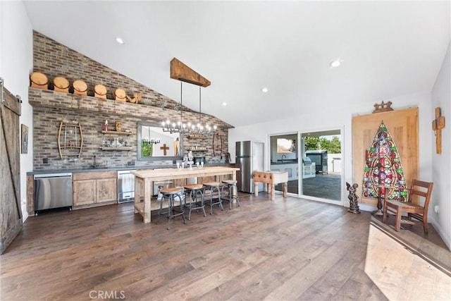 bar with appliances with stainless steel finishes, dark hardwood / wood-style floors, high vaulted ceiling, and pendant lighting