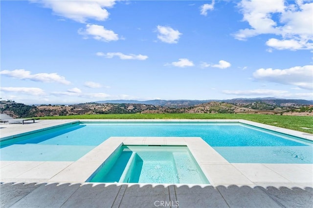 view of pool featuring a mountain view and an in ground hot tub