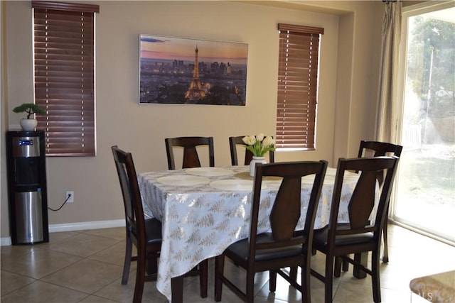 dining area featuring tile patterned flooring and baseboards