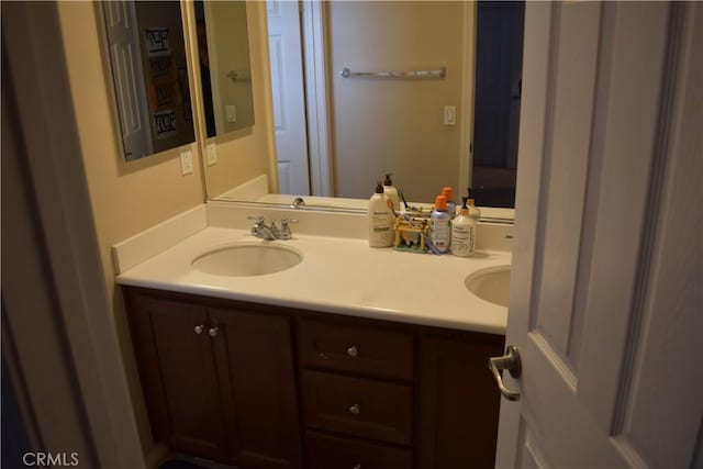 bathroom with double vanity and a sink