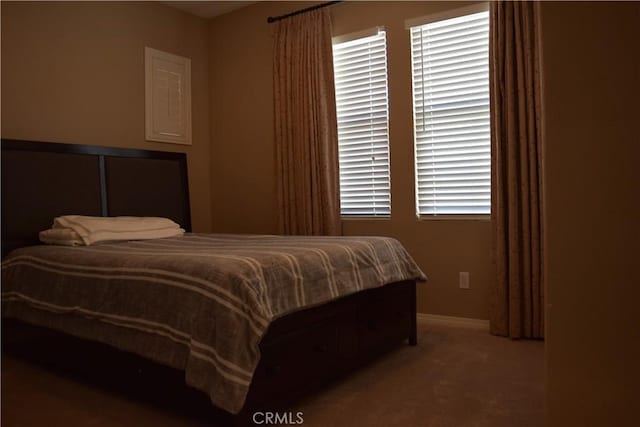 bedroom with carpet and baseboards