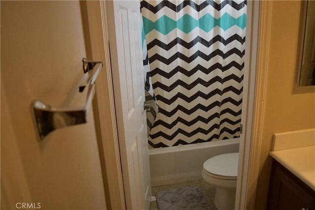 bathroom featuring vanity, shower / bath combo, tile patterned flooring, and toilet