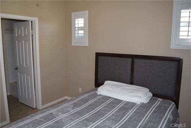 unfurnished bedroom with baseboards