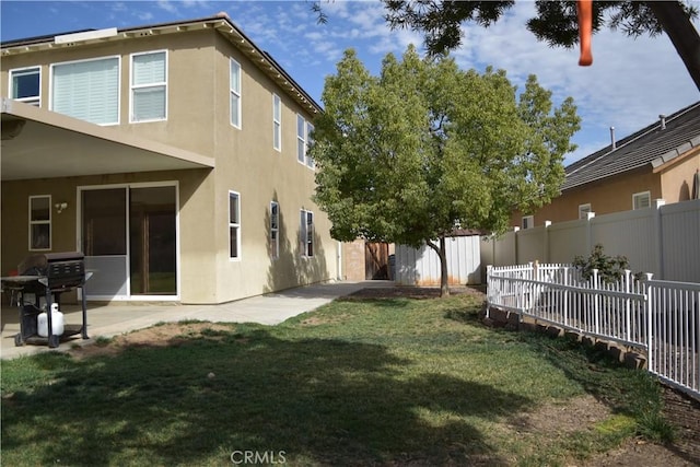 view of yard with a patio area and a fenced backyard