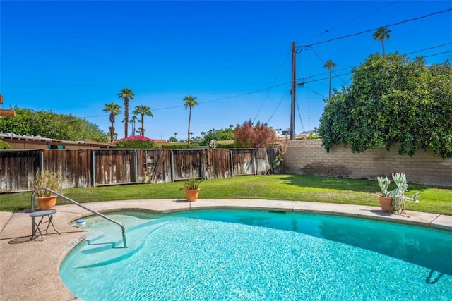 view of pool featuring a yard