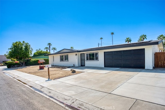 ranch-style home featuring a garage