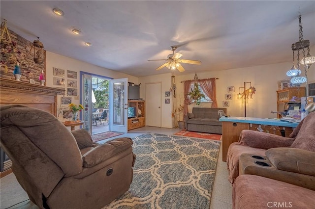 living area featuring a ceiling fan