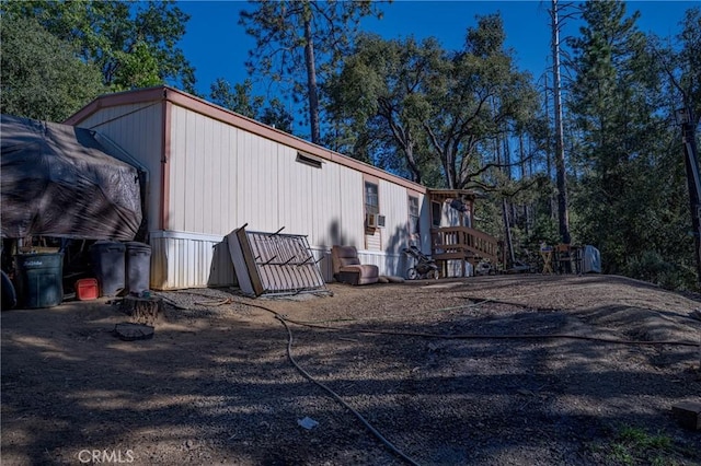 view of side of home featuring cooling unit