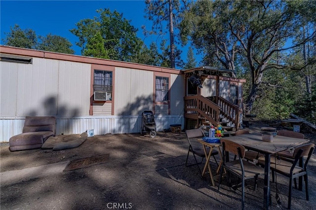 exterior space with outdoor dining space and a patio area