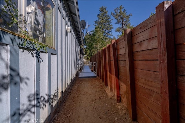 view of property exterior featuring fence