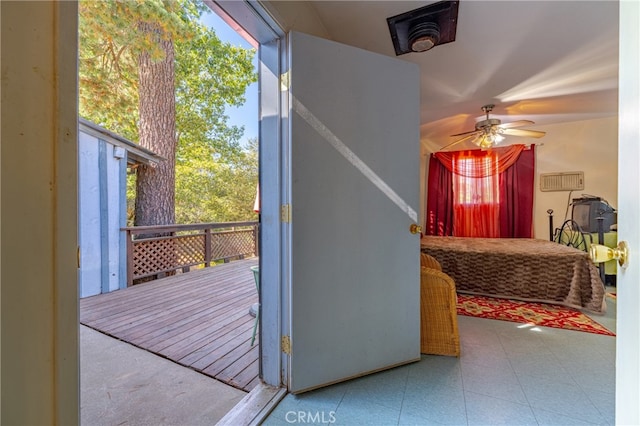 doorway with ceiling fan