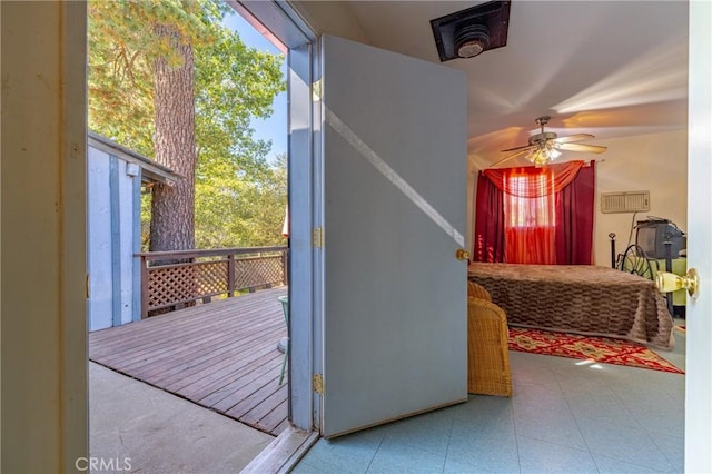 interior space with a healthy amount of sunlight, tile patterned floors, and a ceiling fan