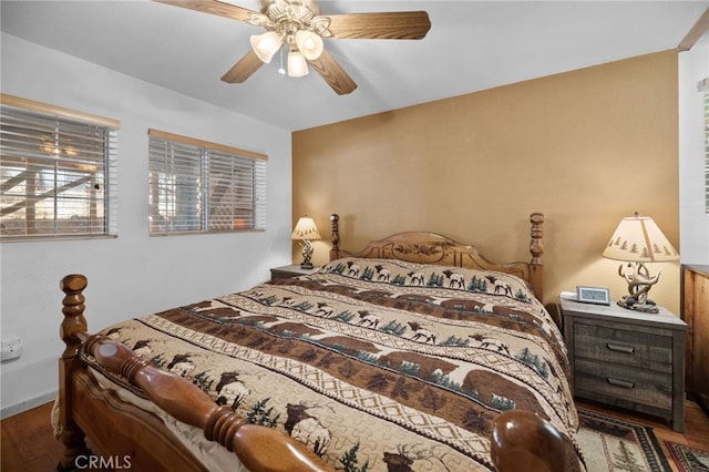 bedroom with hardwood / wood-style flooring and ceiling fan