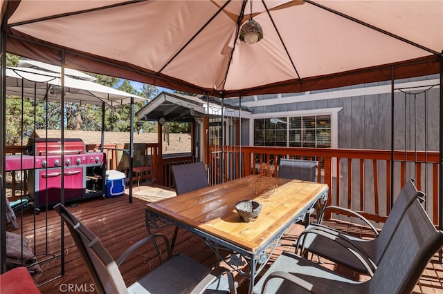 wooden terrace featuring a gazebo