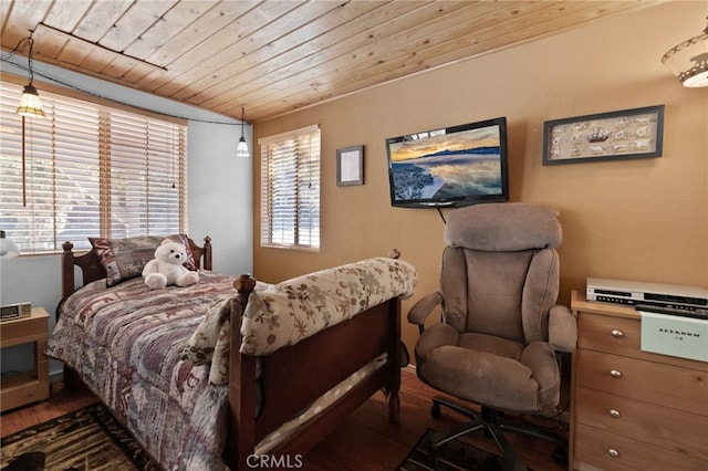 bedroom with multiple windows, wooden ceiling, and dark hardwood / wood-style floors