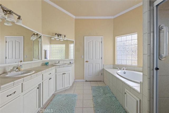 bathroom featuring tiled tub, tile patterned floors, vanity, and ornamental molding