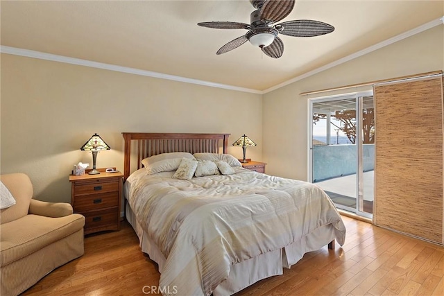 bedroom featuring ceiling fan, access to exterior, vaulted ceiling, light wood-type flooring, and ornamental molding