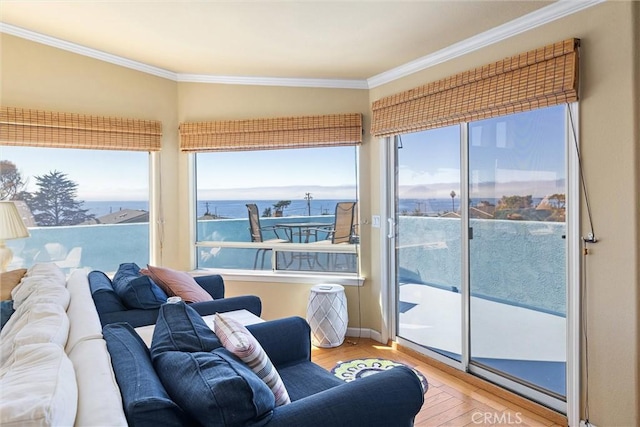 sunroom / solarium with a water view