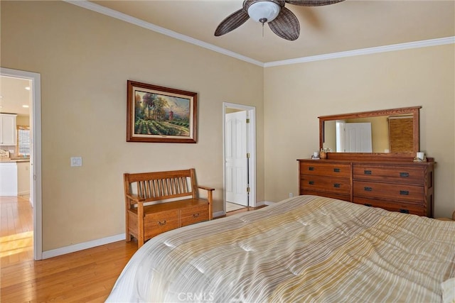 bedroom featuring ceiling fan, crown molding, connected bathroom, and light hardwood / wood-style floors