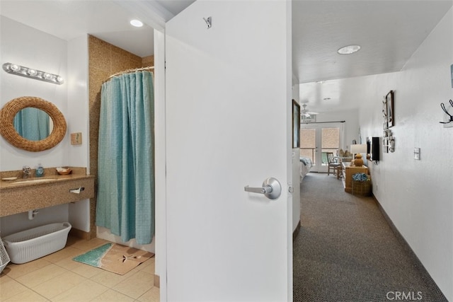 bathroom featuring walk in shower and tile patterned flooring