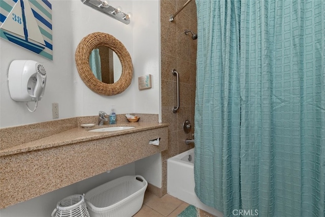 bathroom with shower / bath combination with curtain, tile patterned flooring, and sink