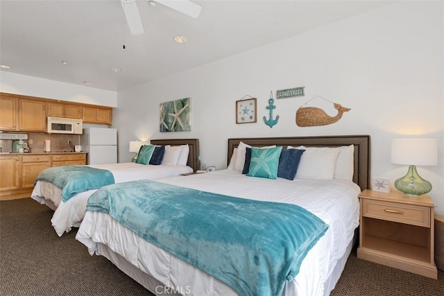 carpeted bedroom featuring ceiling fan and white fridge