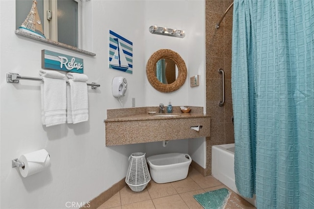 bathroom featuring shower / tub combo with curtain, tile patterned floors, and sink