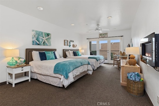 bedroom featuring dark carpet, ceiling fan, and french doors