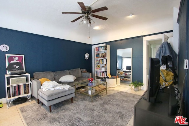 tiled living room with ceiling fan