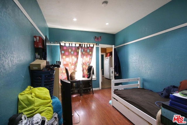 bedroom featuring wood-type flooring