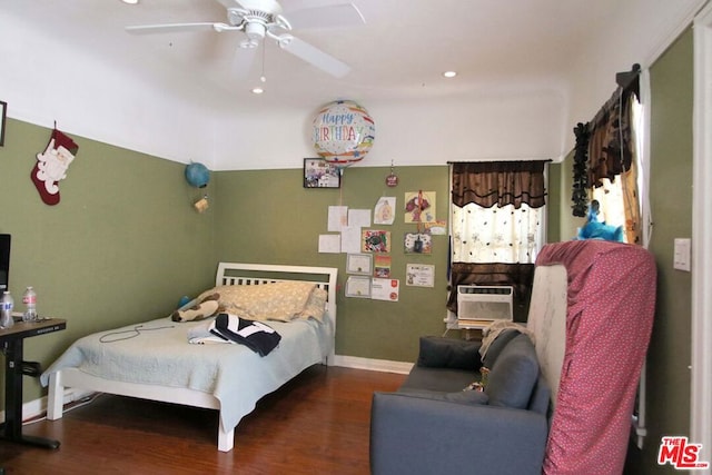 bedroom with ceiling fan and dark hardwood / wood-style flooring