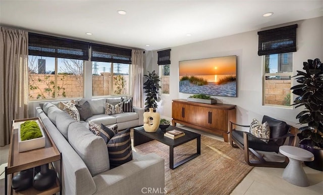 tiled living area featuring recessed lighting