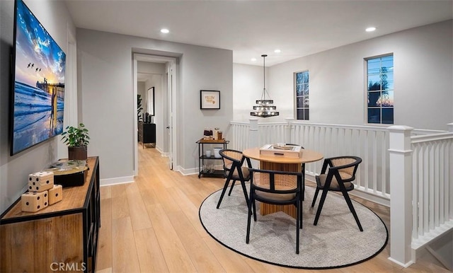 dining room with light wood-style flooring, baseboards, and recessed lighting