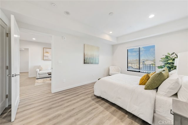 bedroom with light wood-type flooring