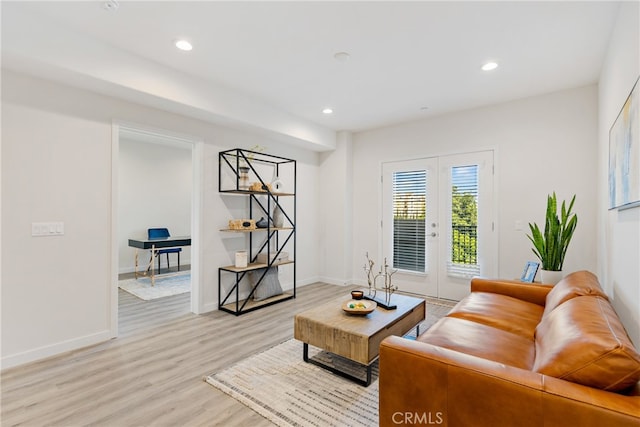 living room featuring light wood-type flooring and french doors